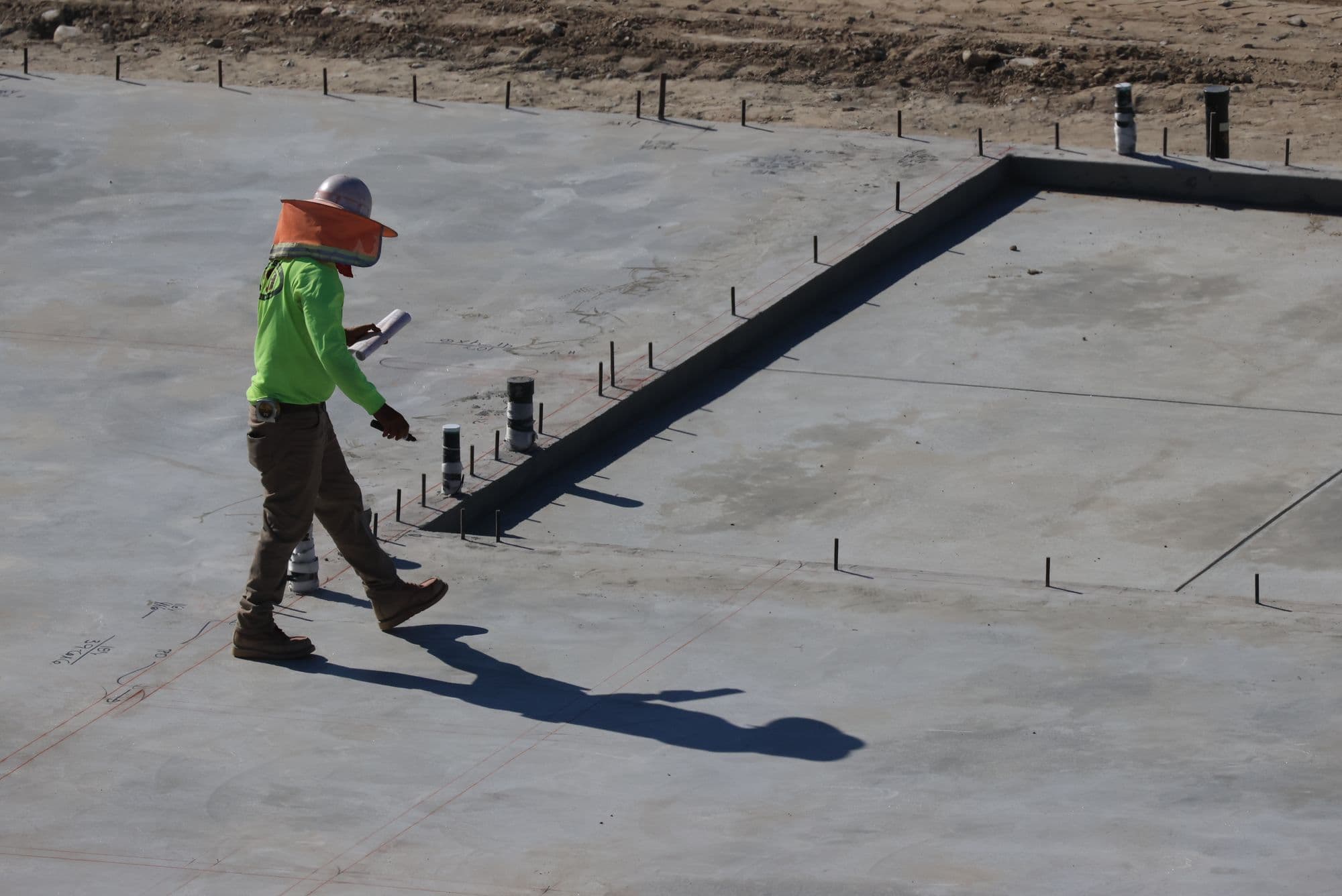A construction professional reviewing an active California jobsite