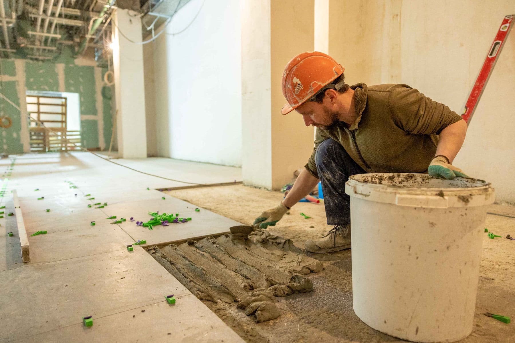 A contractor working inside a light-commercial tenant improvement